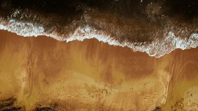 White waves crashing on golden sandy beach. Foamy surf washing over smooth coastline. Sea water spreading across bright wet shore. Ocean foam curving along sunlit sand patterns - Powered by Shutterstock - Get 15% off with code: PIKWIZARD15