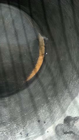 Washing gold dust in prospector pan