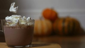 Pouring whipped cream onto hot chocolate drink medium zoom shot slow motion selective focus - Powered by Shutterstock - Get 15% off with code: PIKWIZARD15