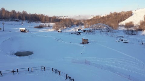 Drone Flying Forward Low above Snowy Landscape