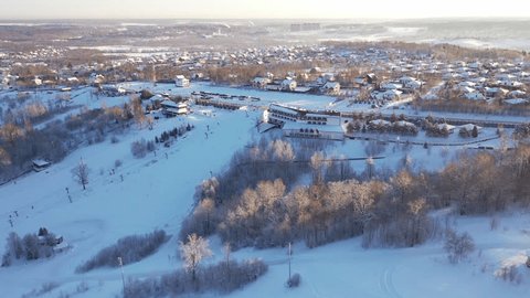 Drone Orbiting above Ski Hill Gentle Downward