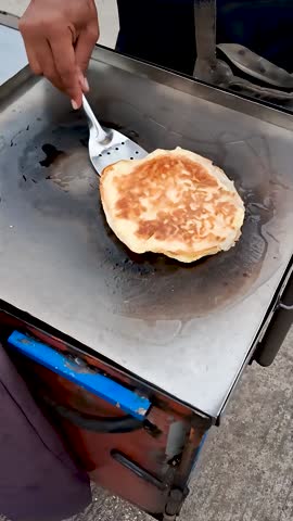 street food vendors selling fried eggs and spring roll skins