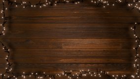 A loop of Christmas lights is framed against a rustic wooden backdrop. The garland is rendered with a touch of realism on aged wooden planks. - Powered by Shutterstock - Get 15% off with code: PIKWIZARD15
