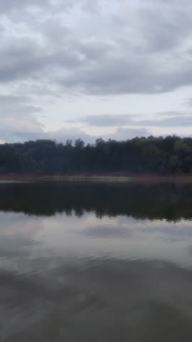 Cloudy sunset over a dam