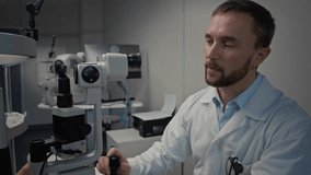 Side view shot of male doctor as ophthalmologist using slit lamp microscope in clinic while performing eye exam for senior woman - Powered by Shutterstock - Get 15% off with code: PIKWIZARD15