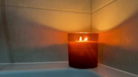Warm Candle Flame Flickering in a Cozy Dim Bathroom Corner – Relaxing Ambient Footage - Powered by Shutterstock - Get 15% off with code: PIKWIZARD15