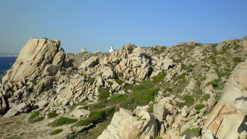 Drone aerial view of Capo Testa cape lighthouse and Valle della Luna beach in Sardinia, Italy