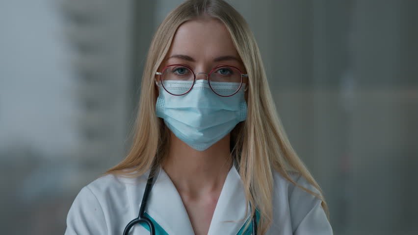 Web cam view angry Caucasian doctor woman in medical face mask shaking finger no disagree disapprove fail talking looking at camera practitioner female nurse girl talk medicine health problem conflict