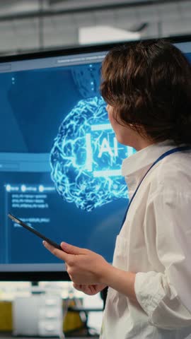 Vertical video Tech startup office CTO doing presentation on machine learning technology to interested investors. IT specialist using display to show business stakeholders latest AI innovations