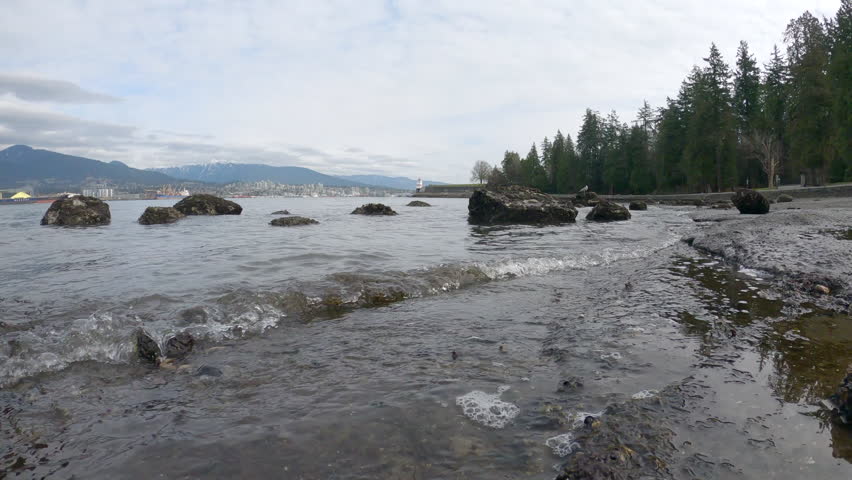 Brockton Point Rocky Shoreline 4K UHD.A rocky shoreline along Burrard Inlet near the Brockton Point Lighthouse. Stanley Park, Vancouver. 4K UHD.
