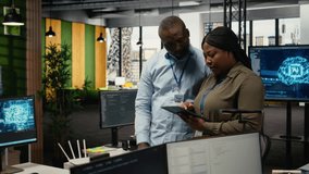 Team of software developers in office automating workflows using artificial intelligence. IT staff members refining deep learning computational models for faster processing, camera A - Powered by Shutterstock - Get 15% off with code: PIKWIZARD15