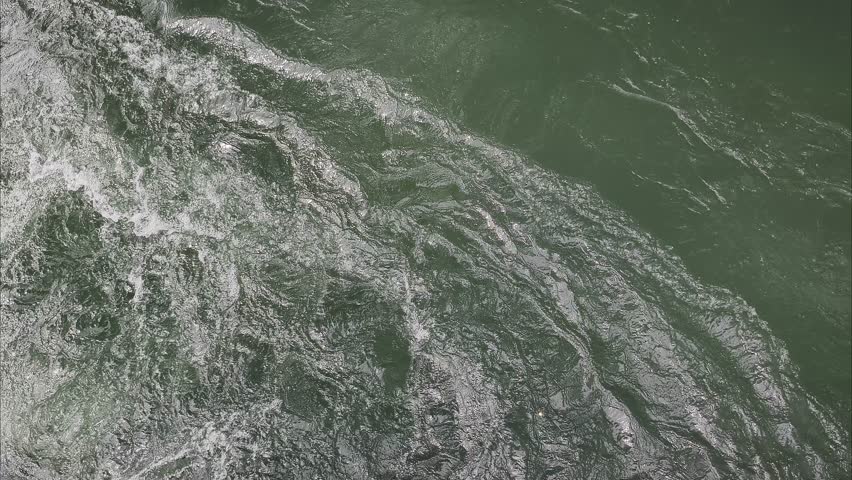 water ripple and wave into the river or lake