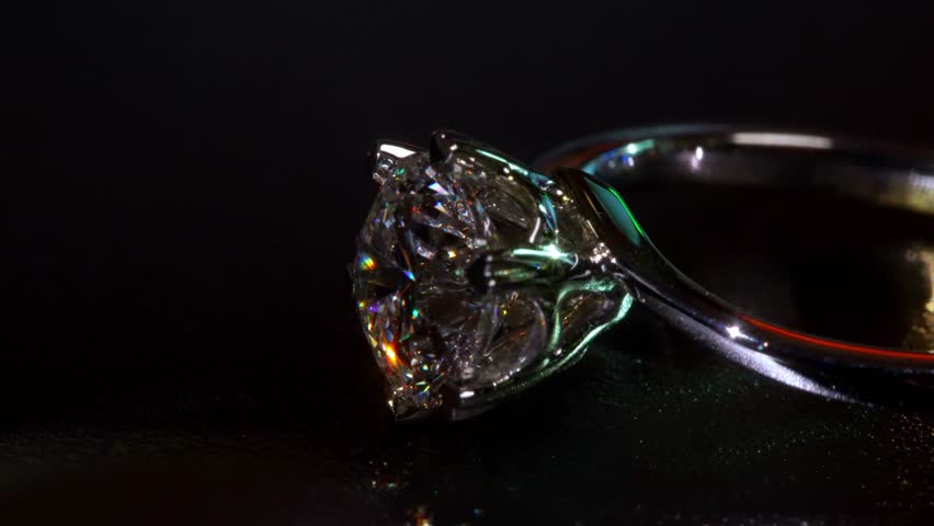 Dazzling Diamond Gold Ring Appears in Soft Artistic Macro Shot. Featuring Clear Facets and Smooth Metal Curves. Refined Show of Luxury, Beauty and Craftsmanship With Mesmerizing Precision Close-up 4k