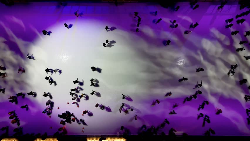 Aerial view of ice skating rink in Montreal with colorful lights and winter motion. g.