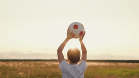 boy jumping up nature, child kid sunset, child victory, feeling victory, people ball, hands raised up sunny sky victory, silhouette of young footballer with ball overhead, boy holding soccer ball at - Powered by Shutterstock - Get 15% off with code: PIKWIZARD15