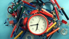 Alarm clock and school supplies fly and fall. Filmed on a high-speed camera at 1000 fps. High quality FullHD footage - Powered by Shutterstock - Get 15% off with code: PIKWIZARD15