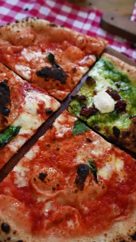 A circular camera move glides over quartered pizzas — margherita, verde and fungi. Warm crusts, vibrant toppings and artisanal textures highlight an authentic Italian buffet-style presentation.