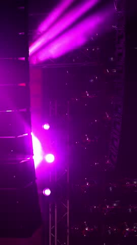 Spotlights in the concert hall. Stage light with colored spotlights and smoke.