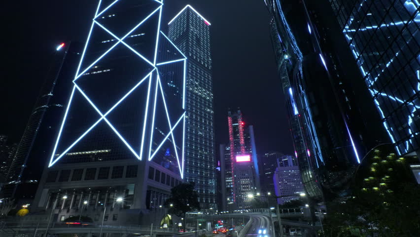 Modern Skyscrapers Illuminating Hong Kong Night Skyline. Luminous Skyscrapers Rising Against Dark Evening Backdrop, Hong Kong