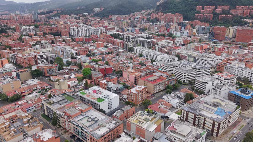 Aerial view of colorful buildings in Bogota, Colombia, under cloudy skies