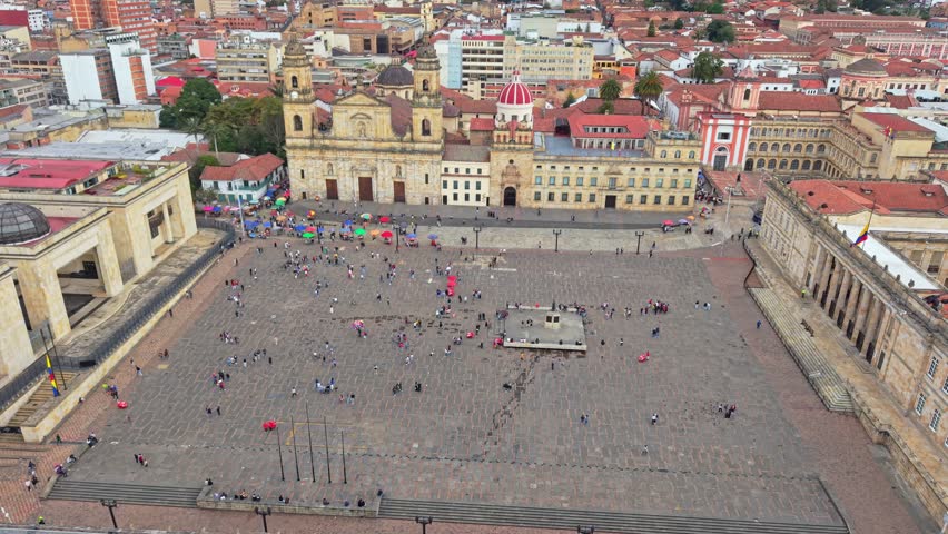 Aerial view of Catedral Primada and Plaza de Bolivar in Bogota, vibrant and busy