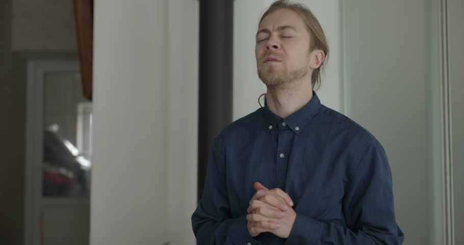 Male Christian is Praying before Meal. Religious man Prayer. 4K 10-bit