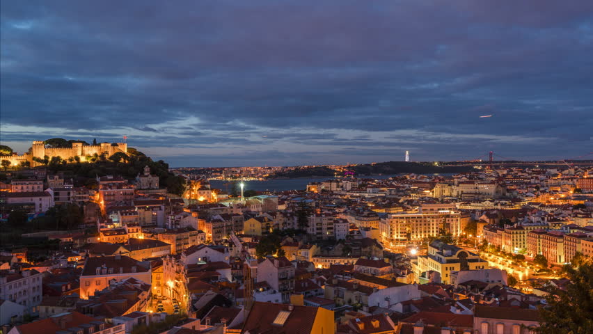 Lisbon, Portugal, panoramic timelapse of Lisbon cityscape at sunrise, zooming in.