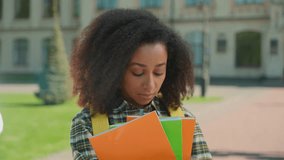 Sad upset African woman student hold books couple talking background bullying frustrated girl education high school university college problem study discrimination man female heartbreak jealous love - Powered by Shutterstock - Get 15% off with code: PIKWIZARD15