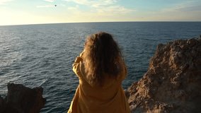 Adventure Freedom Nature Woman Shaking Long Hair Above The Ocean At Golden Hour Vertical video. - Powered by Shutterstock - Get 15% off with code: PIKWIZARD15