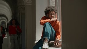 African American student guy sit university windowsill stroking cat girls come male man college sleeping pet animal friendly three multiracial diversity female women students smiling friendship teens - Powered by Shutterstock - Get 15% off with code: PIKWIZARD15