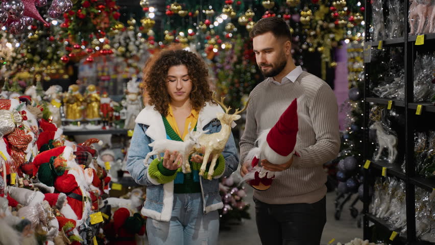 Young couple shopping for Christmas decorations in a store