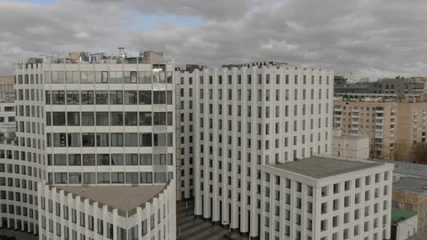 Aerial Approach along Modern Residential Towers