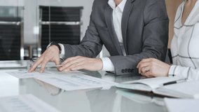 Business partners analyzing corporate data during a meeting, discussing financial reports and market trends. Business-people concept - Powered by Shutterstock - Get 15% off with code: PIKWIZARD15