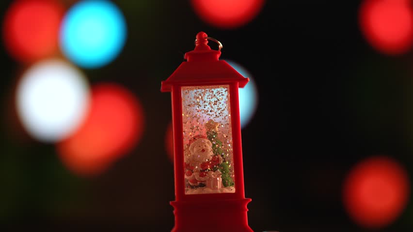 Festive Lantern with Santa Claus and Holiday Lights