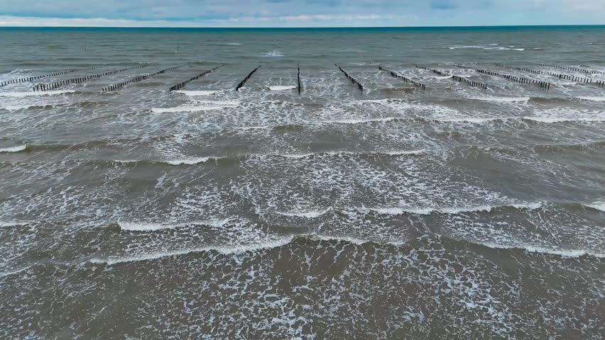 Aerial drone view of an oyster farm on Normandy coast of France. High quality 4k footage