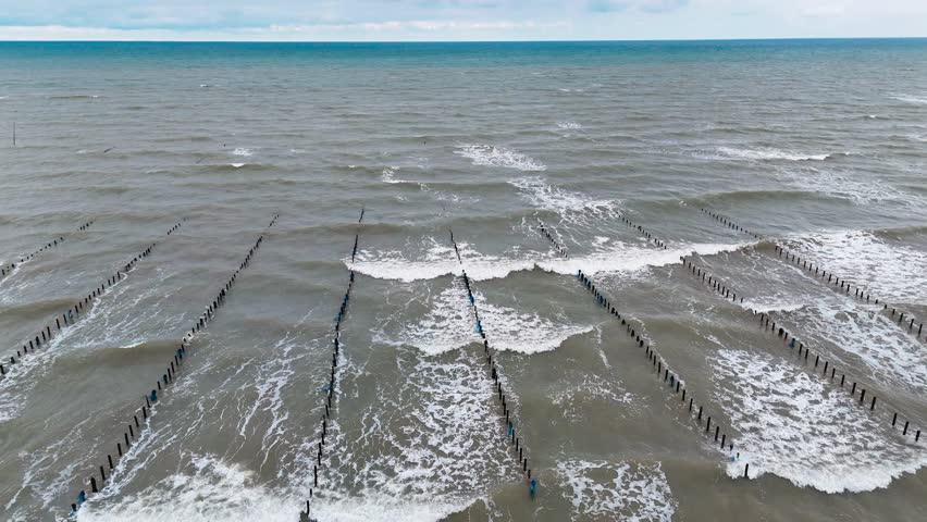 Aerial drone view of an oyster farm on Normandy coast of France. High quality 4k footage