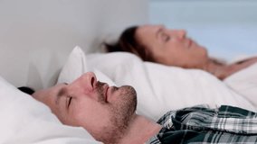 Older Couple Sleeping Soundly In Their Cozy Bed - Powered by Shutterstock - Get 15% off with code: PIKWIZARD15