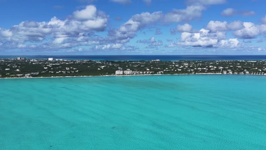 Long Bay Beach At Turks And Caicos In Overseas Territory United Kingdom. Caribbean Skyline. Beach Landscape. Highrise Buildings. Long Bay Beach In United Kingdom. Nature Background