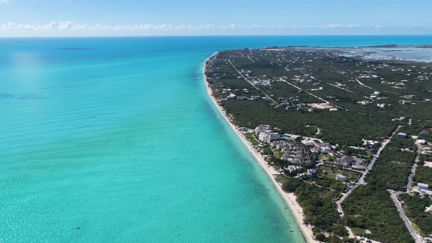 Long Bay Beach At Turks And Caicos In Overseas Territory United Kingdom. Caribbean Skyline. Beach Landscape. Highrise Buildings. Long Bay Beach In Turks And Caicos. Nature Background.