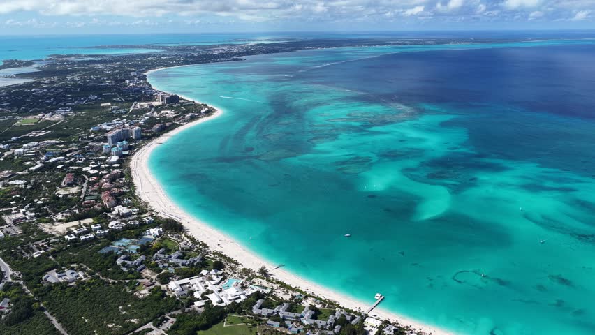 Grace Bay Beach At Providenciales In Overseas Territory Turks And Caicos Islands. Caribbean Beach. Tropical Scenery. Stunning Highrise Buildings. Grace Bay Beach In Turks And Caicos Islands.