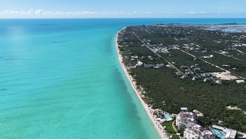 Long Bay Beach At Turks And Caicos In Overseas Territory United Kingdom. Caribbean Skyline. Beach Landscape. Highrise Buildings. Long Bay Beach In United Kingdom. Nature Background