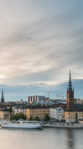 Stockholm, Sweden. Scenic View Of Stockholm Skyline At Summer Evening. Famous Popular Destination Scenic Place In Dusk Lights. Riddarholm Church In Day To Night Transition Time Lapse.