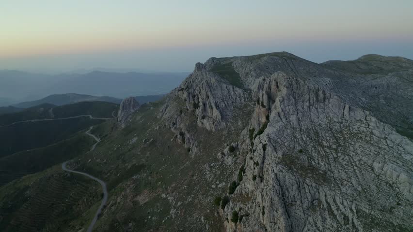 Aerial drone view of Siniscola Punta Cupeti mountain landscape at sunset in Sardinia, Italy