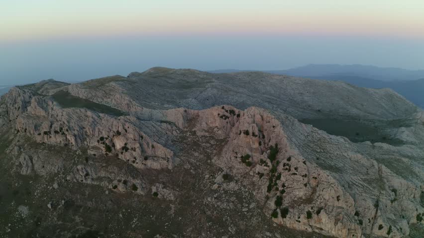 Aerial drone view of Siniscola Punta Cupeti mountain landscape at sunset in Sardinia, Italy