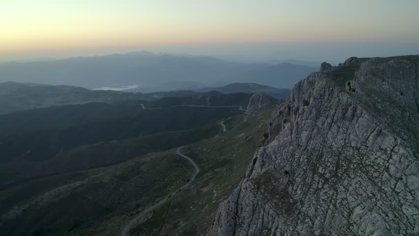 Aerial drone view of Siniscola Punta Cupeti mountain landscape at sunset in Sardinia, Italy