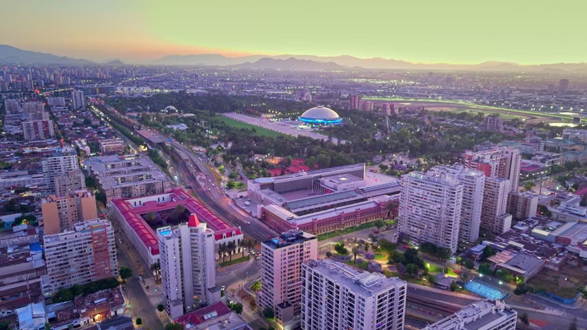 Aerial Sunset of Santiago de Chile city Parque O'Higgins and Movistar Arena Dome