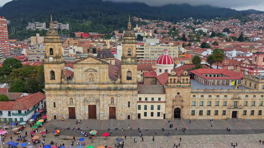 Left-to-right aerial pan showing Catedral Primada and Plaza de Bolívar in Bogotá.