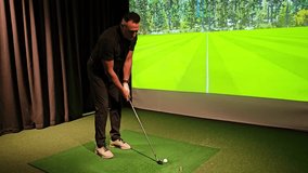 Golf practice indoors with simulation technology and swing analysis at a training center - Powered by Shutterstock - Get 15% off with code: PIKWIZARD15