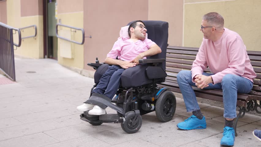 Person with a disability talking with a friend