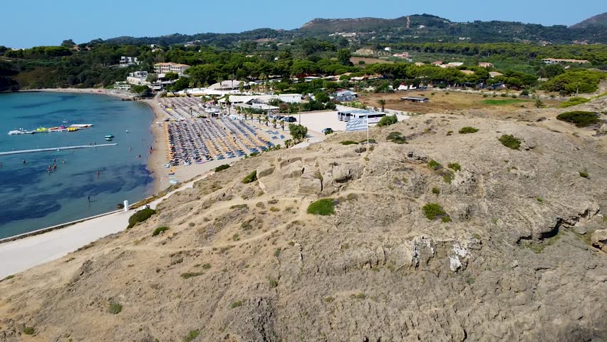 Drone Footage of St. Nicholas Beach Zakynthos, Greece Flag and Chapel of Agios Nikolaos
